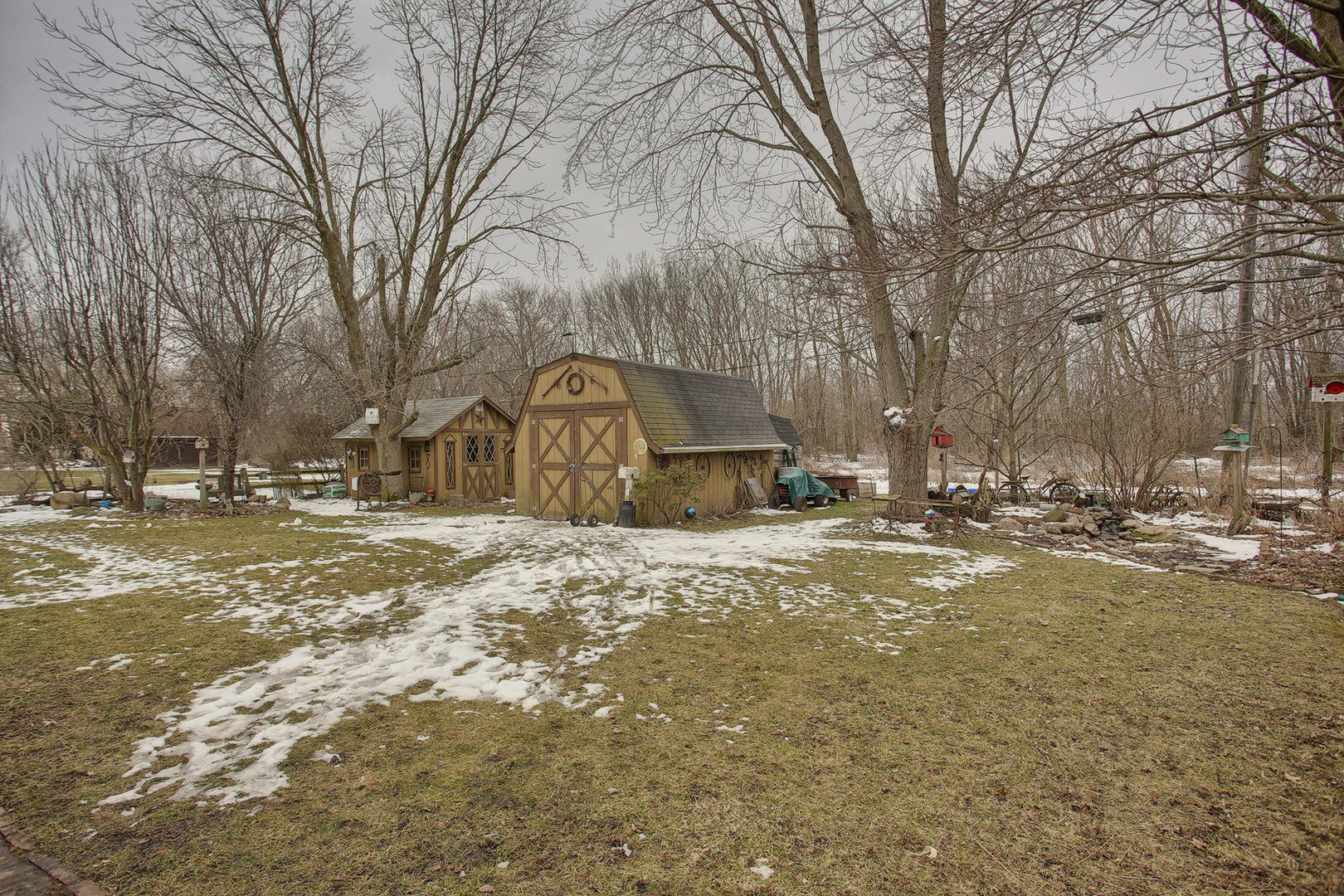 408 Kyle Street Ogden, IL 61859 - Photo 21 of 24 a front view of a house with a yard covered with snow