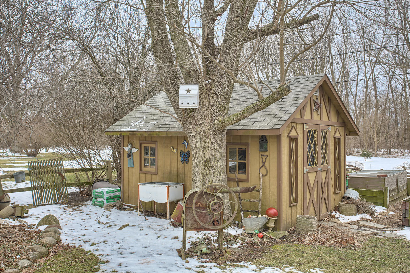 408 Kyle Street Ogden, IL 61859 - Photo 22 of 24 a view of a house with a chairs and wooden fence