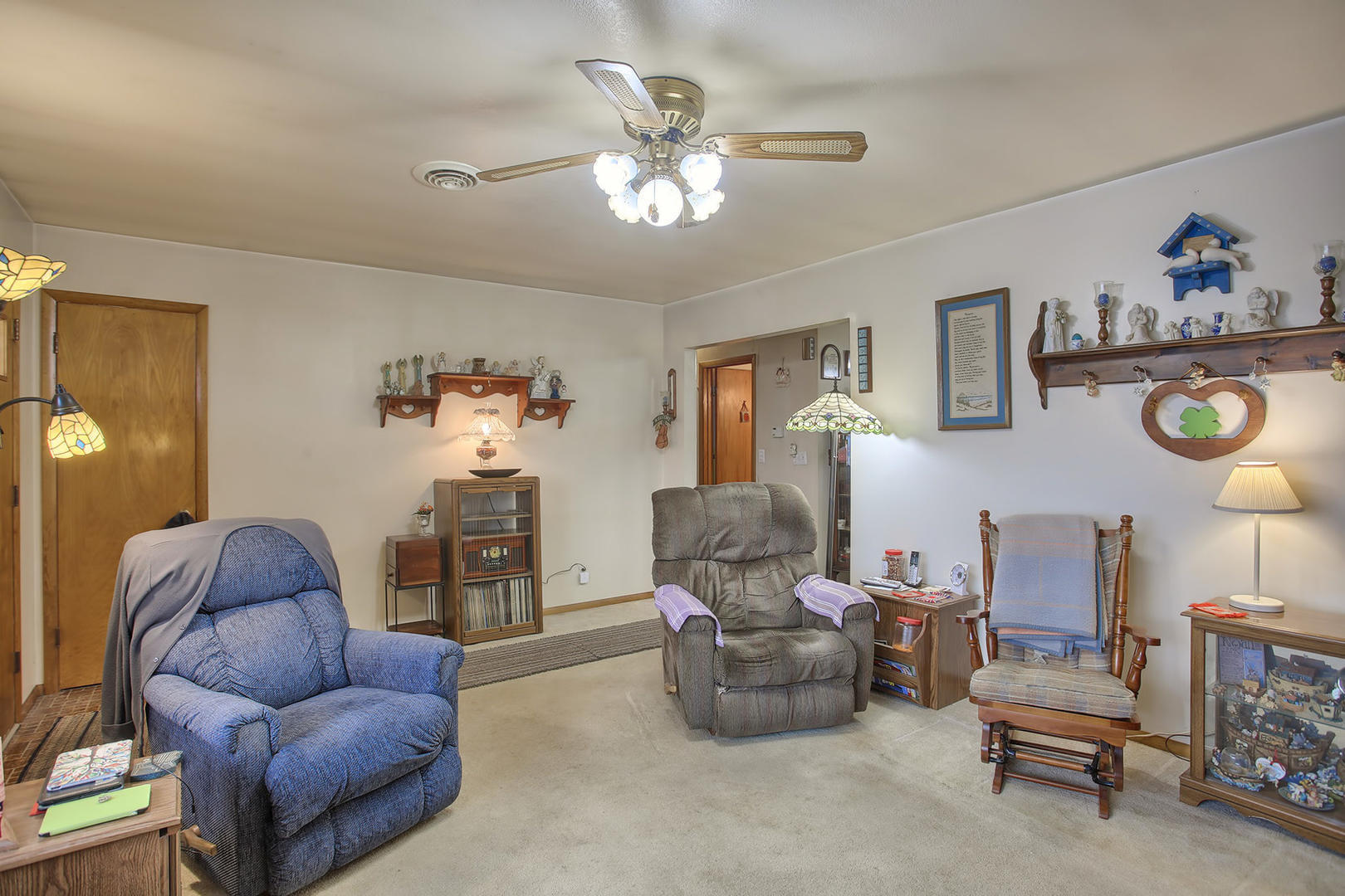 408 Kyle Street Ogden, IL 61859 - Photo 4 of 24 a living room with furniture and a chandelier