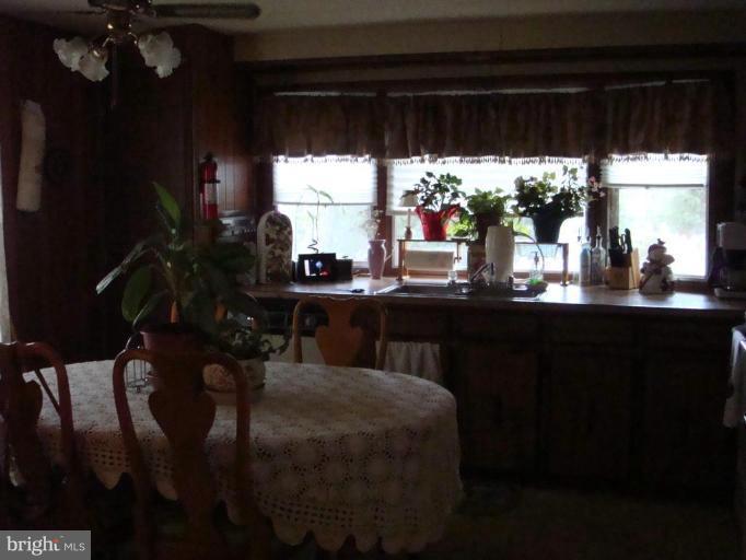 19515 Frederick Road, Unit 191 Germantown, MD 20876 - Photo 2 of 13 a kitchen with a table and chairs in it