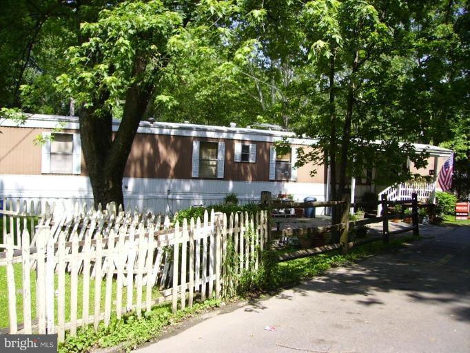 19515 Frederick Road, Unit 191 Germantown, MD 20876 - Photo 12 of 13 a front view of a house with a yard