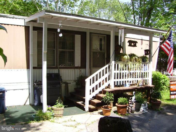 19515 Frederick Road, Unit 191 Germantown, MD 20876 - Photo 13 of 13 a view of a house with a yard and porch