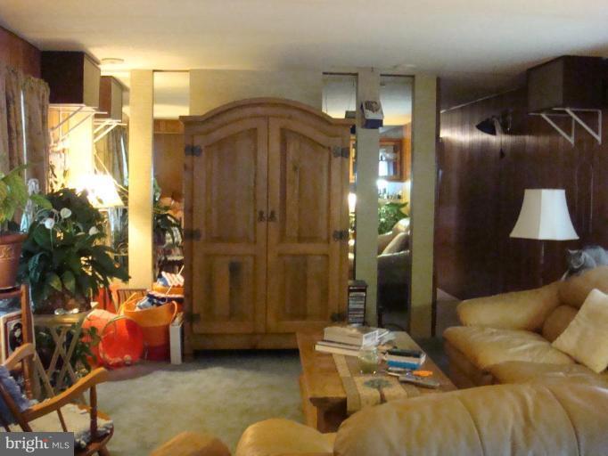 19515 Frederick Road, Unit 191 Germantown, MD 20876 - Photo 4 of 13 a living room with furniture and a lamp