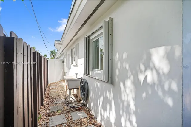 a view of a living room with furniture and a window