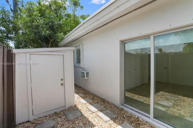 a bathroom with a shower and a sink
