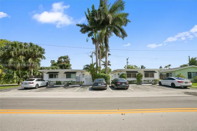 a view of a street with cars on road
