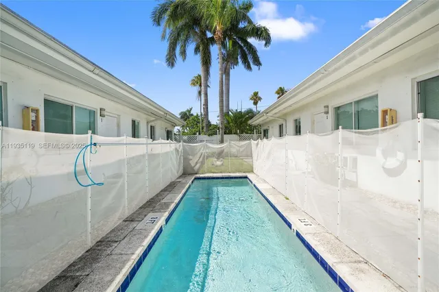 a view of a backyard with potted plants