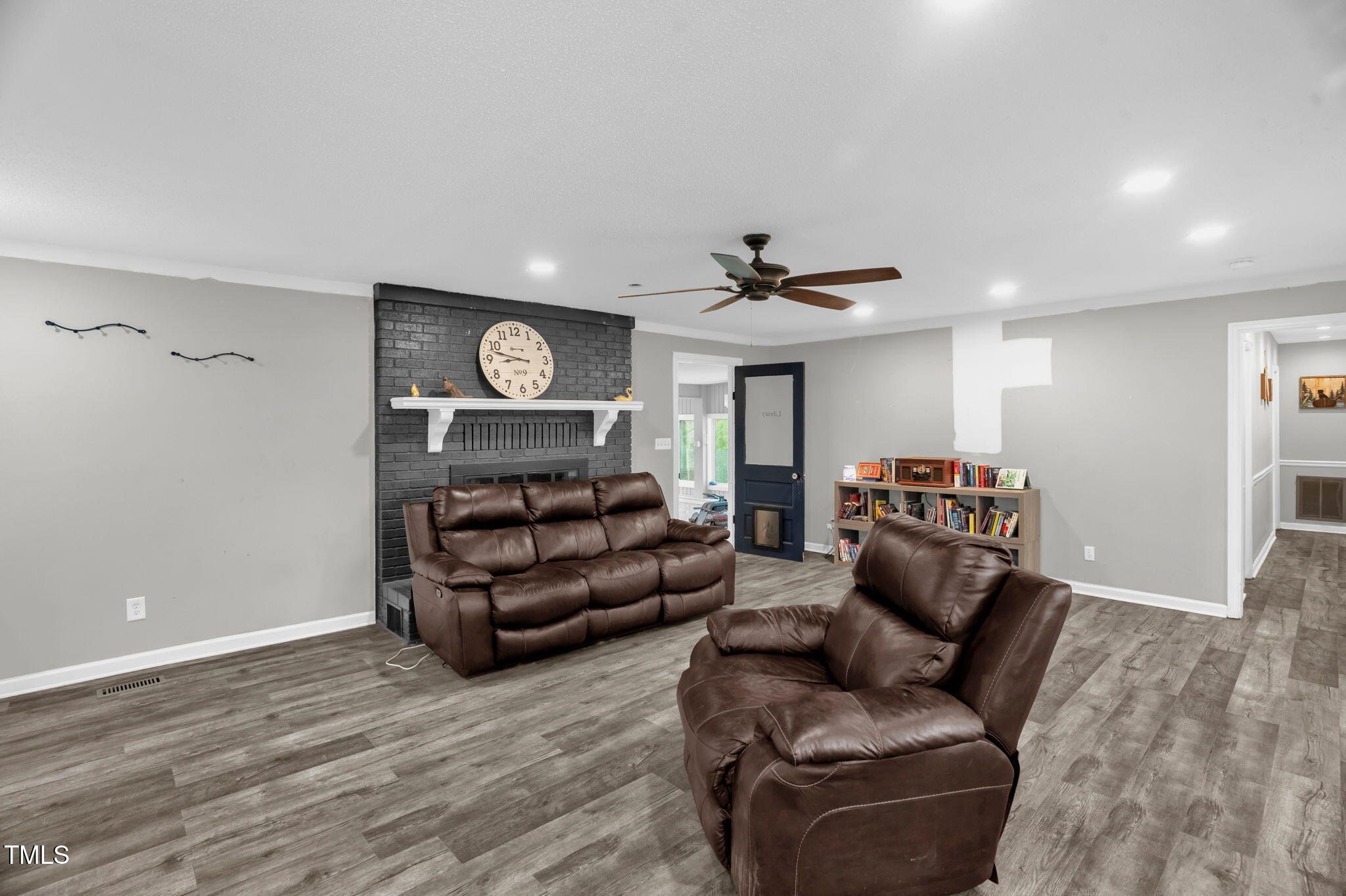 1022 Glover Road Dunn, NC 28334 - Photo 14 of 31 a living room with furniture and a wooden floor