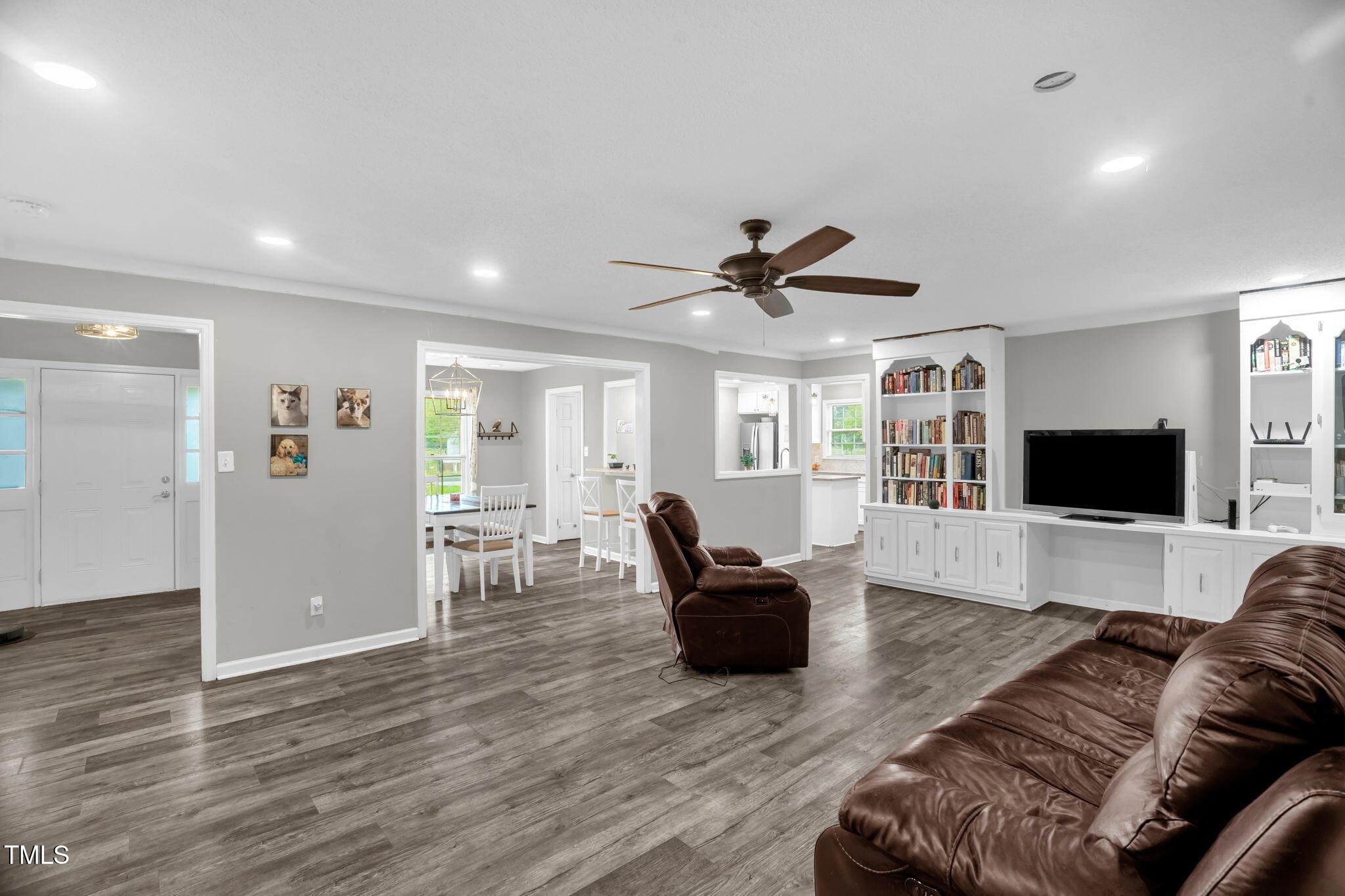 1022 Glover Road Dunn, NC 28334 - Photo 16 of 31 a living room with furniture and a flat screen tv