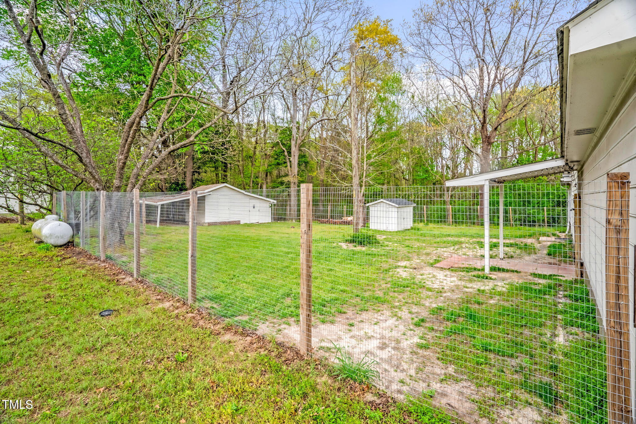 1022 Glover Road Dunn, NC 28334 - Photo 27 of 31 a view of a house with backyard and a tree