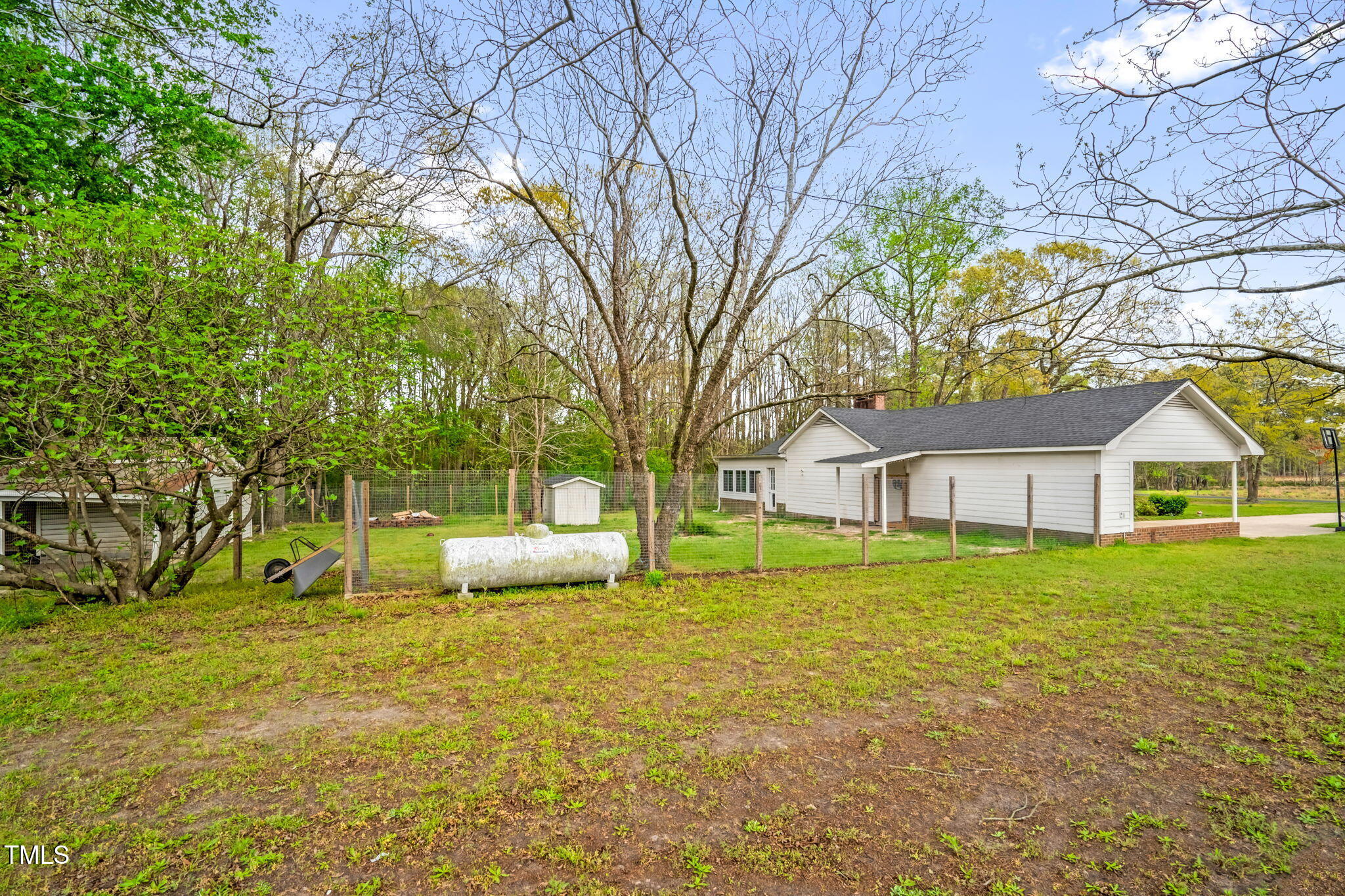 1022 Glover Road Dunn, NC 28334 - Photo 28 of 31 a front view of house with yard and trees around