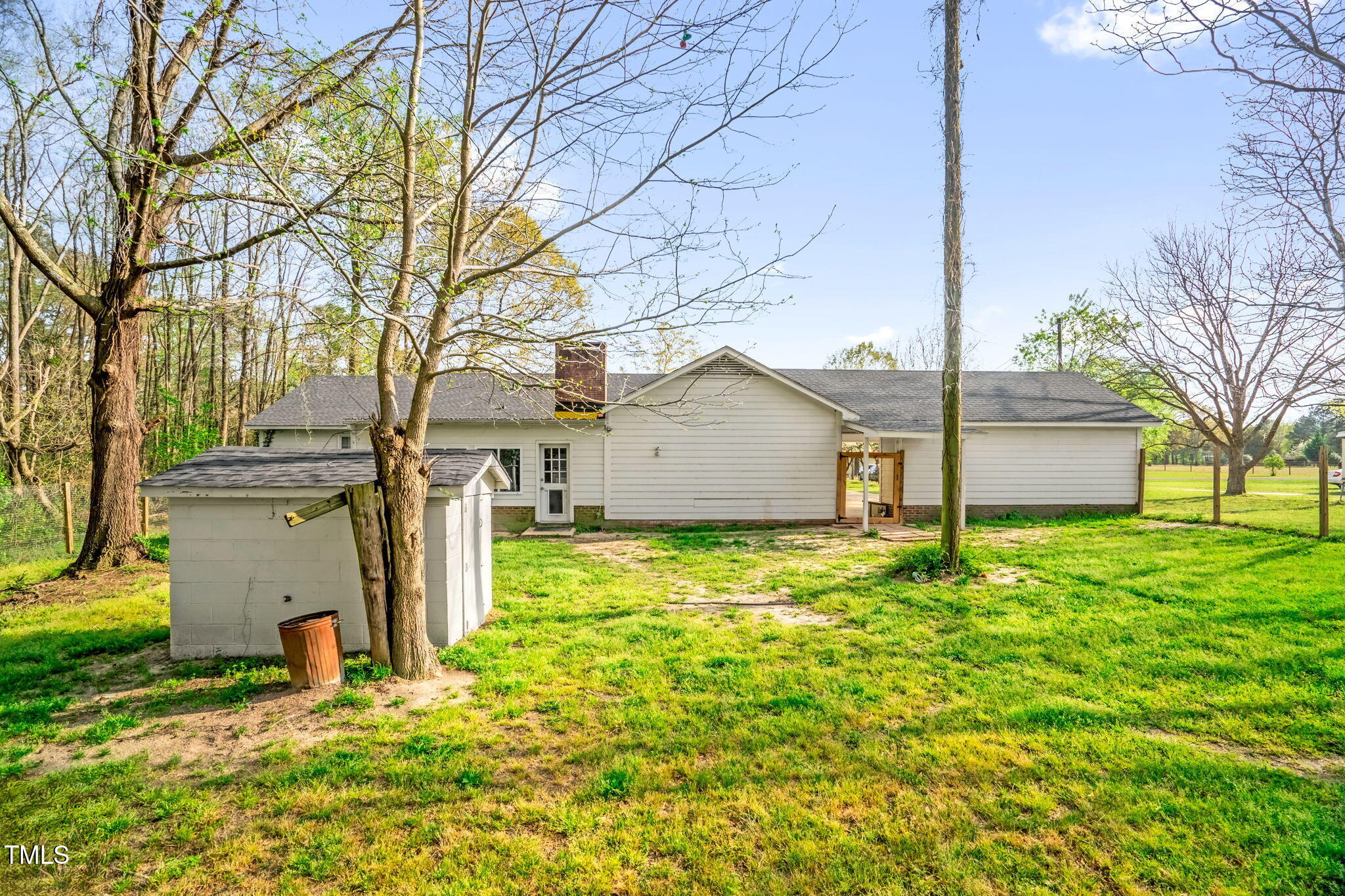 1022 Glover Road Dunn, NC 28334 - Photo 29 of 31 a backyard of a house with table and chairs