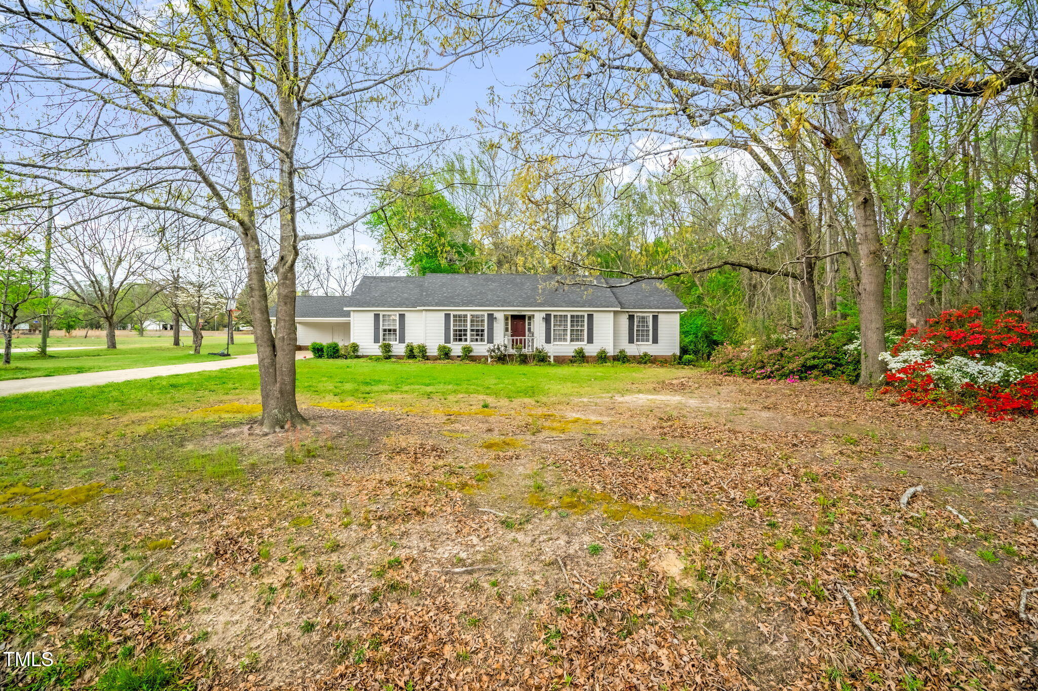 1022 Glover Road Dunn, NC 28334 - Photo 2 of 31 a view of a house with garden and trees