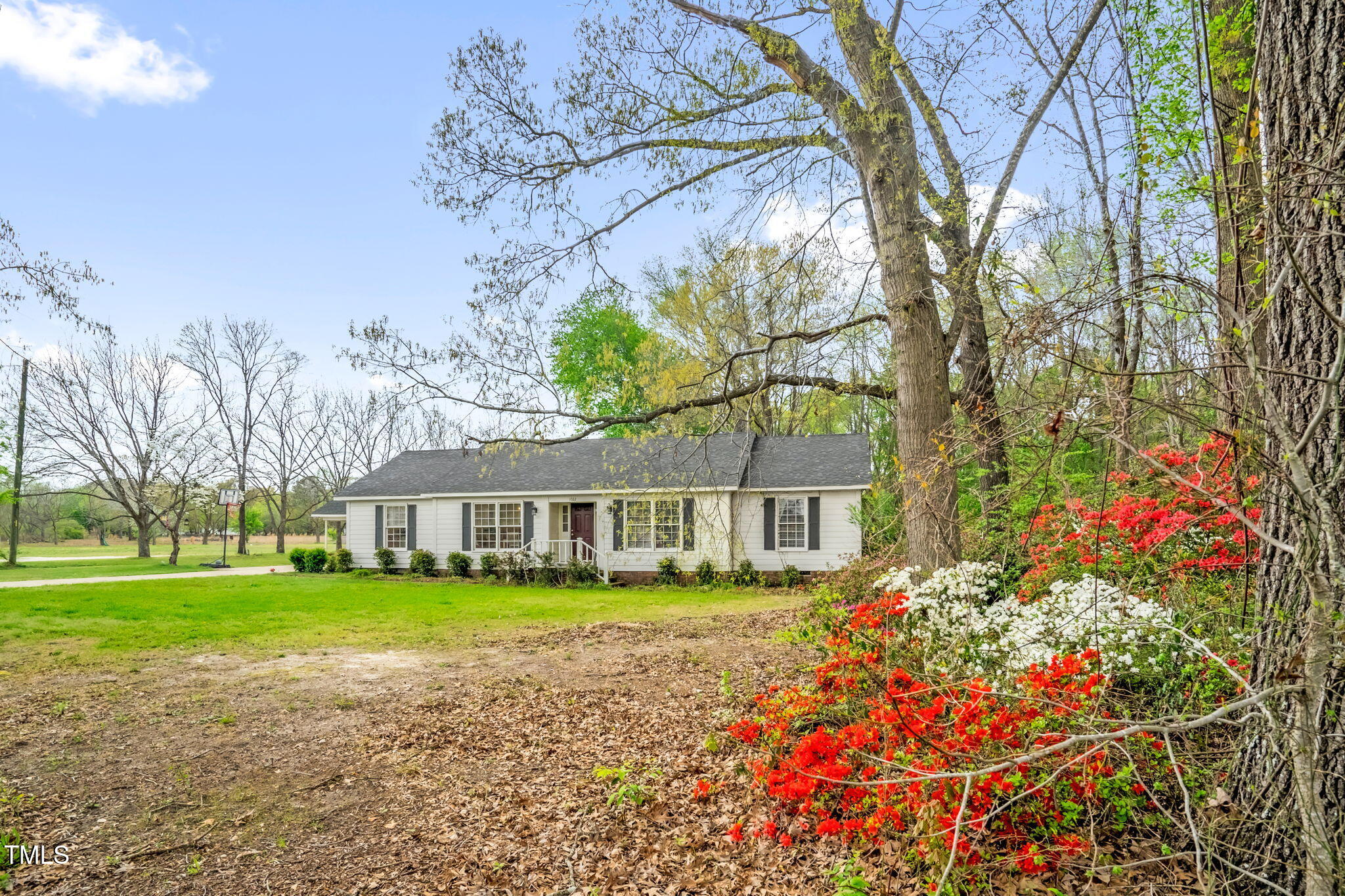 1022 Glover Road Dunn, NC 28334 - Photo 3 of 31 a house with garden in front of it