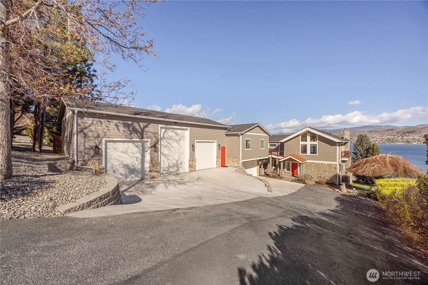 21 Grace Lane Chelan, WA 98816 - Photo 1 of 37 a view of a house with wooden fence