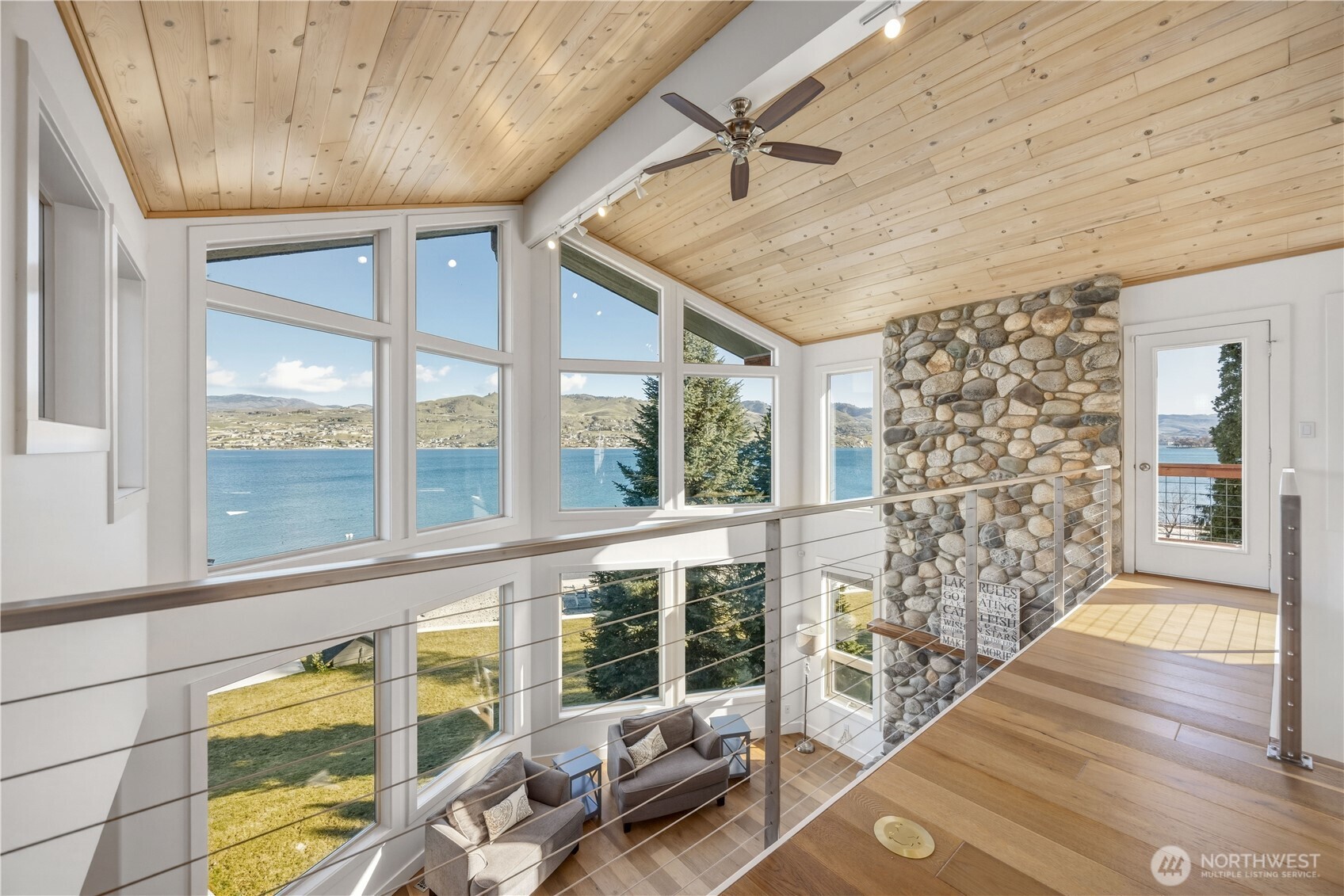 21 Grace Lane Chelan, WA 98816 - Photo 12 of 37 a view of a livingroom with wooden floor and furniture