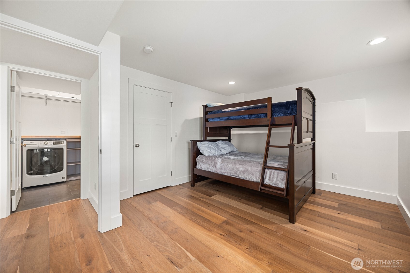 21 Grace Lane Chelan, WA 98816 - Photo 22 of 37 a bedroom with wooden floor and a sink