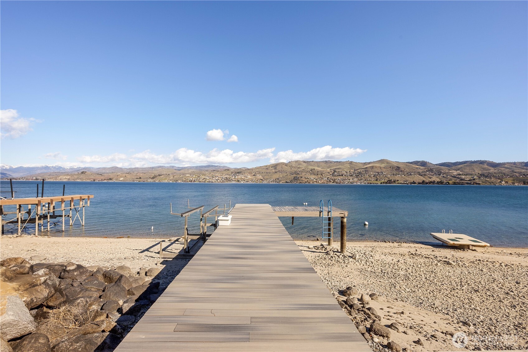 21 Grace Lane Chelan, WA 98816 - Photo 28 of 37 a view of a lake with tables and chairs