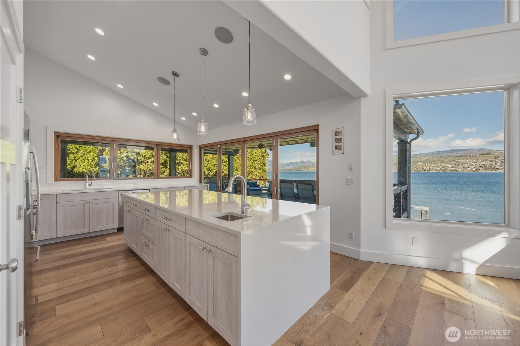21 Grace Lane Chelan, WA 98816 - Photo 8 of 37 a large white room with a large window and furniture