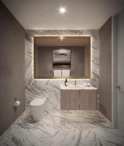 a living room with toilet sink and a flat screen tv