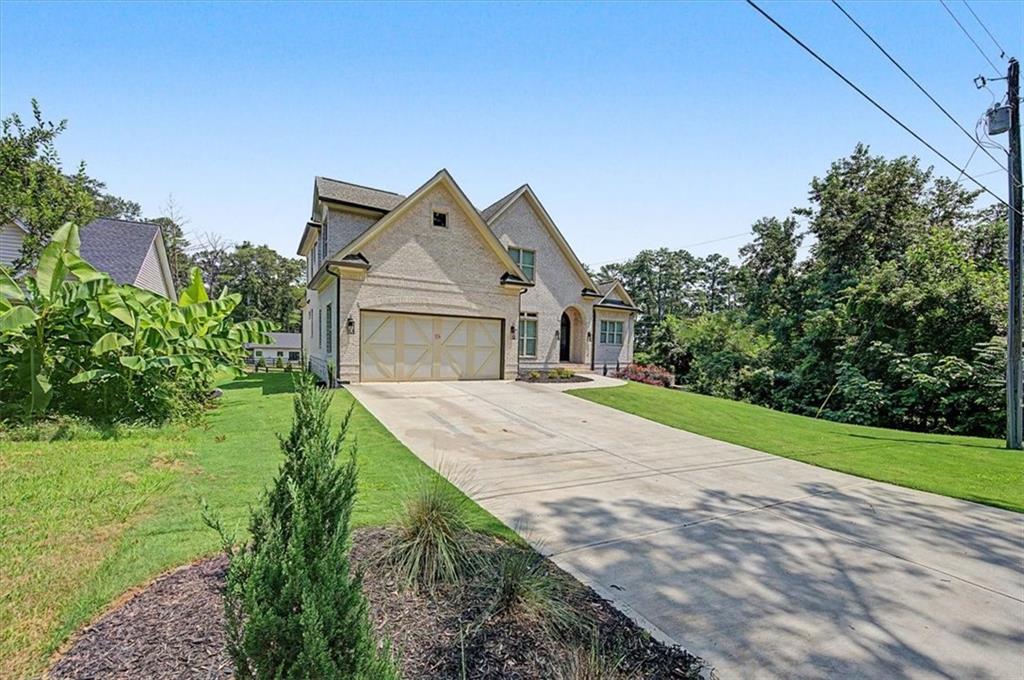 217 Laura Lake Road Marietta, GA 30066 - Photo 3 of 54 a front view of a house with a yard