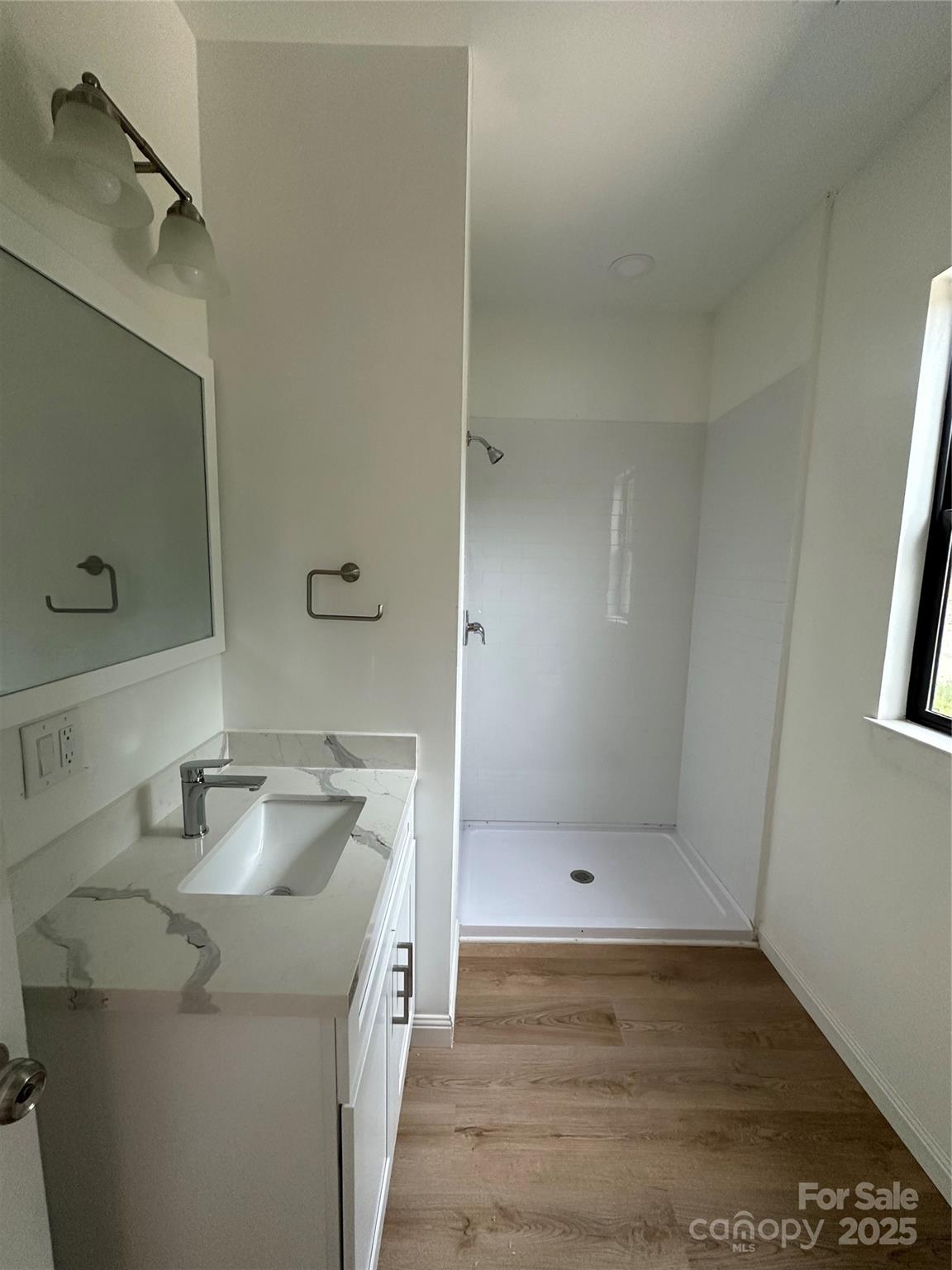 804 3rd St Place Southwest Hickory, NC 28602 - Photo 9 of 10 a bathroom with a sink a toilet and shower