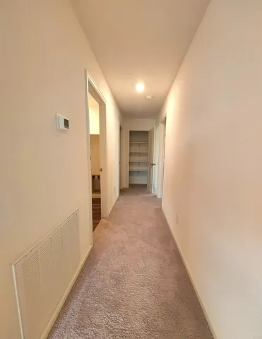 a view of hallway with stairs