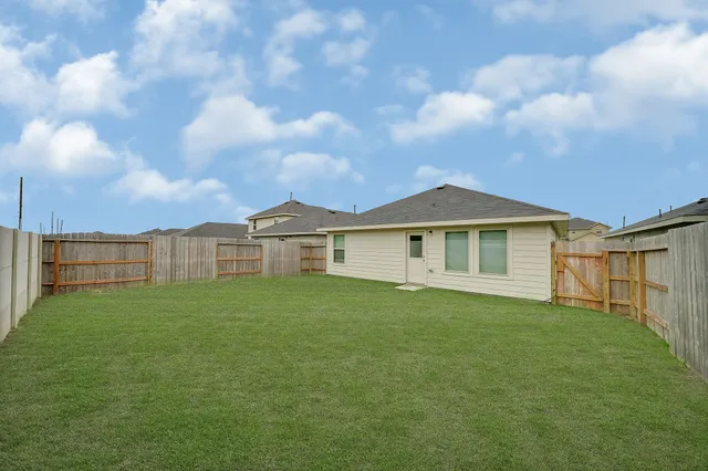 a view of a yard in front of a house with a yard