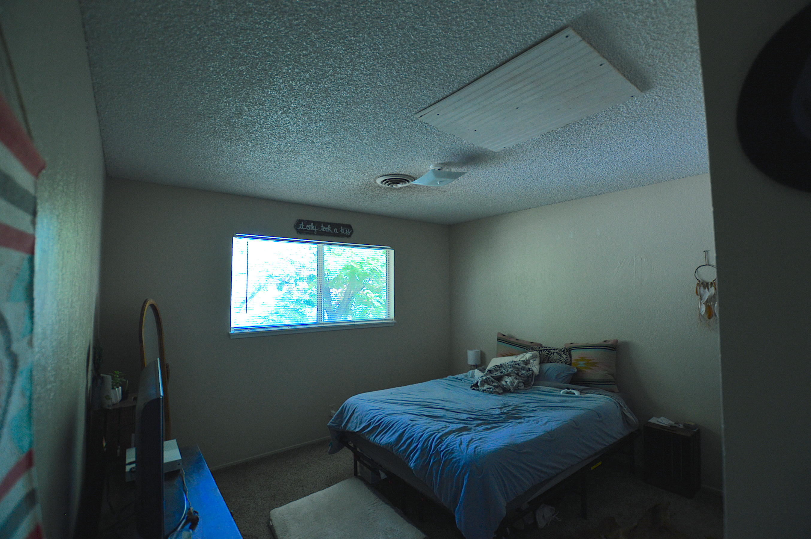 1005 Layton Road Redding, CA 96002 - Photo 17 of 17 a bed sitting in a bedroom next to a window