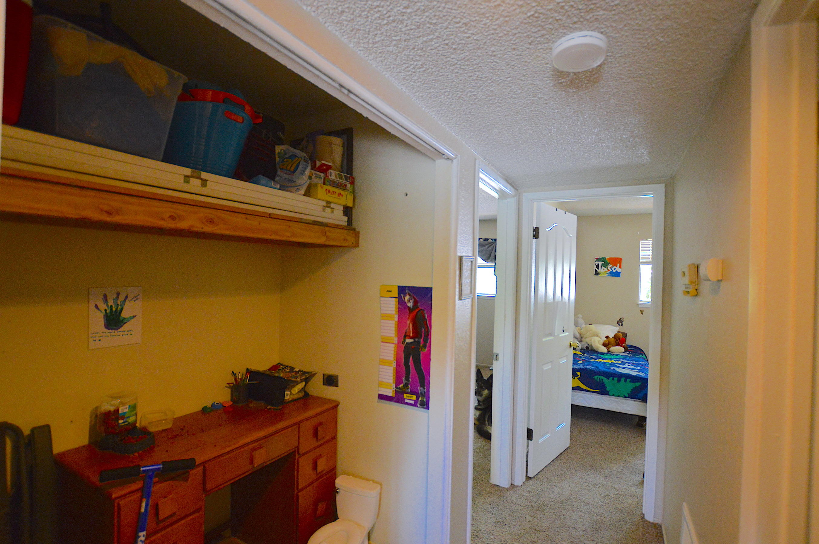 1005 Layton Road Redding, CA 96002 - Photo 6 of 17 a view of a hallway and a livingroom with furniture