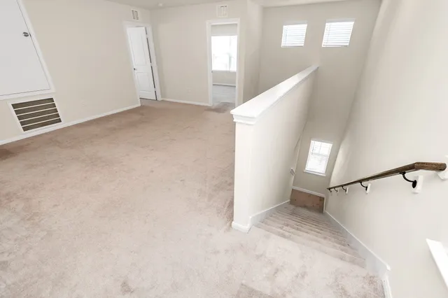 a view of a hallway with staircase