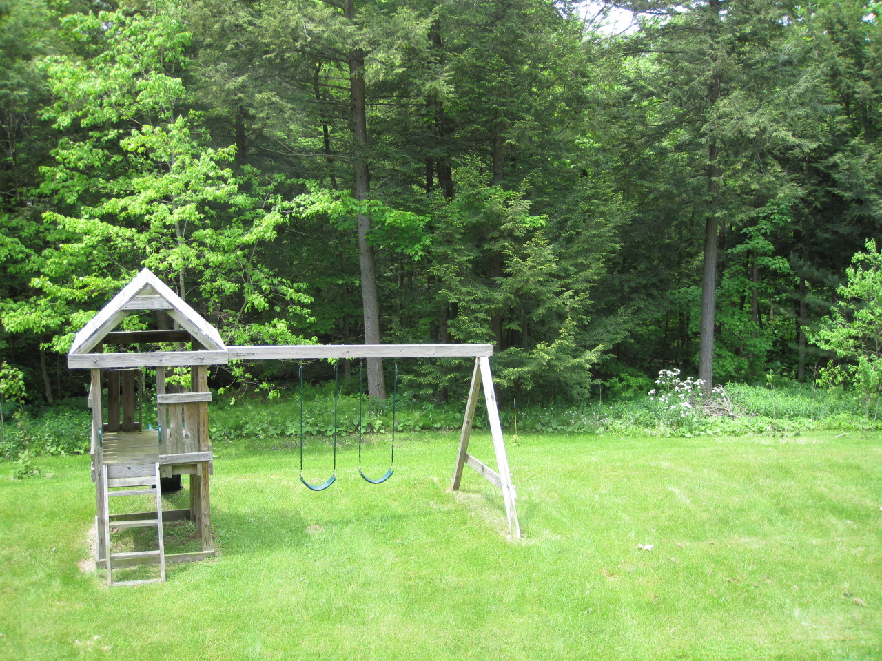 614 W Road Richmond, MA 01254 - Photo 18 of 19 a view of house with a big yard and potted plants
