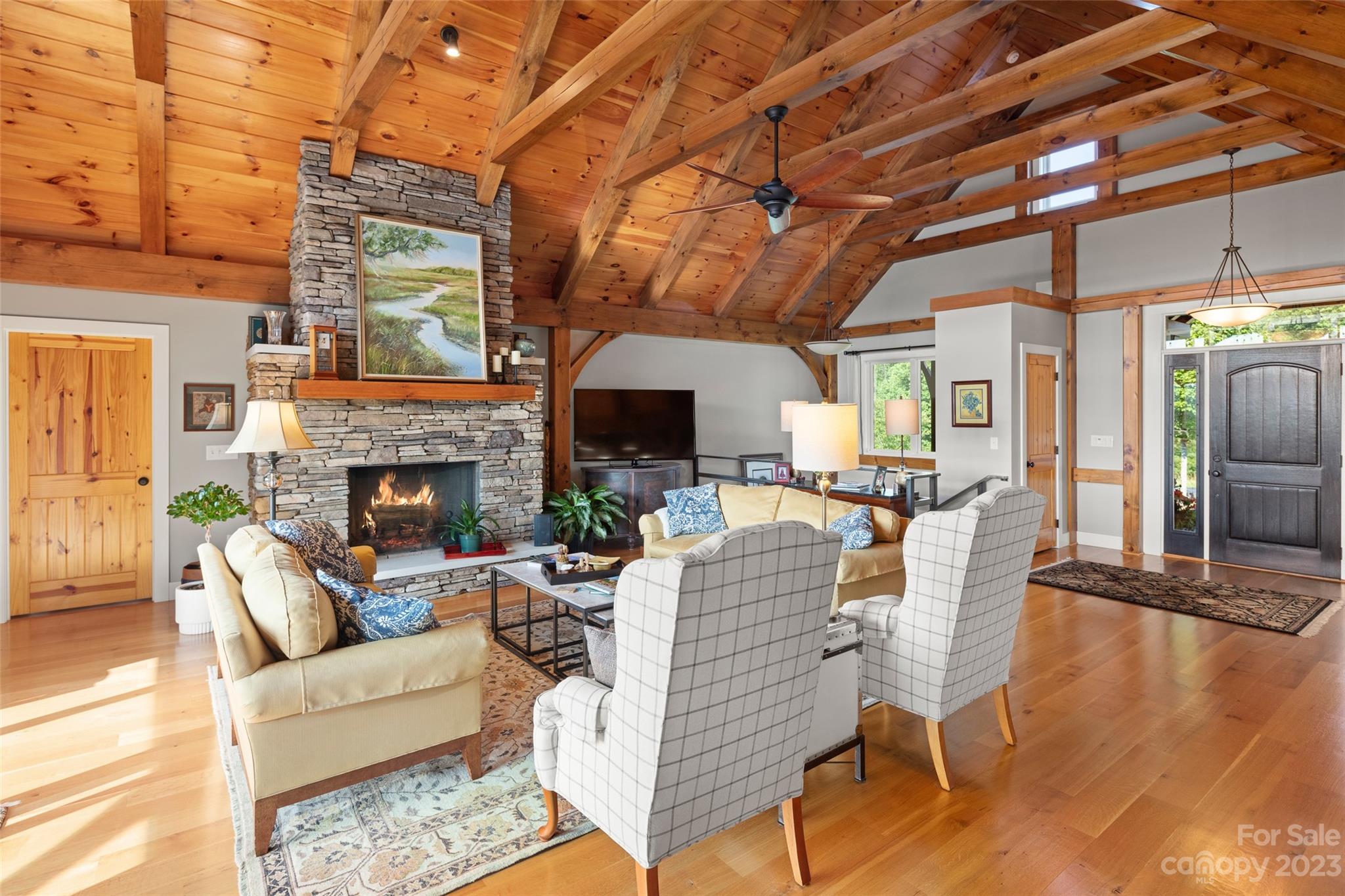 285 Red Tail Trail Mill Spring Mill Spring, NC 28756 - Photo 11 of 48 a living room with furniture a fireplace and a flat screen tv