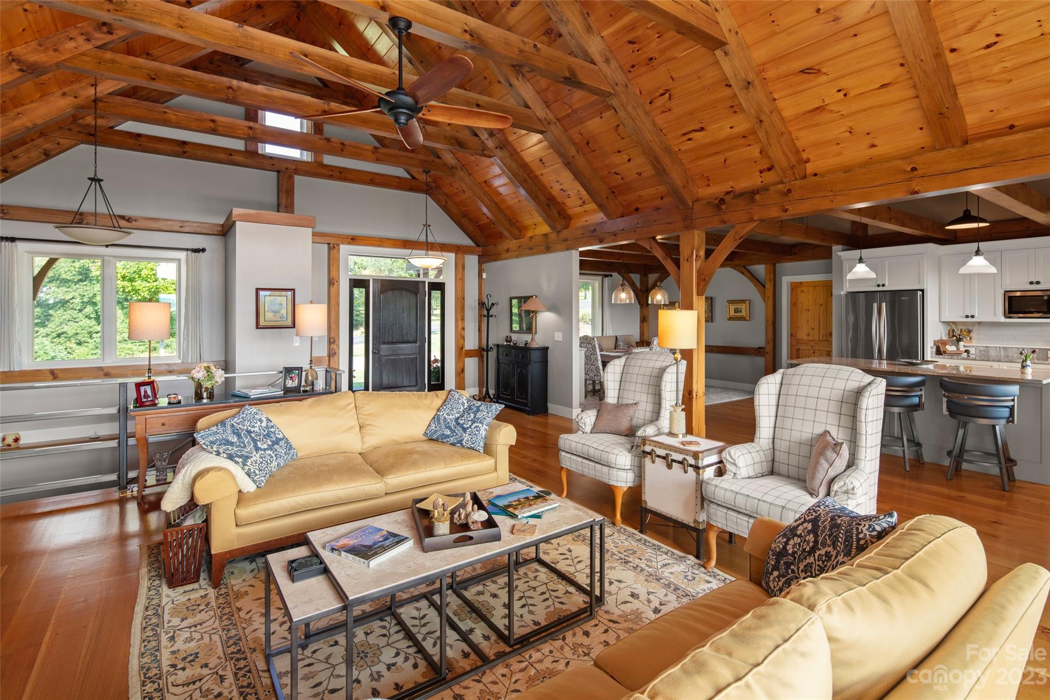 285 Red Tail Trail Mill Spring Mill Spring, NC 28756 - Photo 12 of 48 a living room with furniture a wooden floor and next to a window