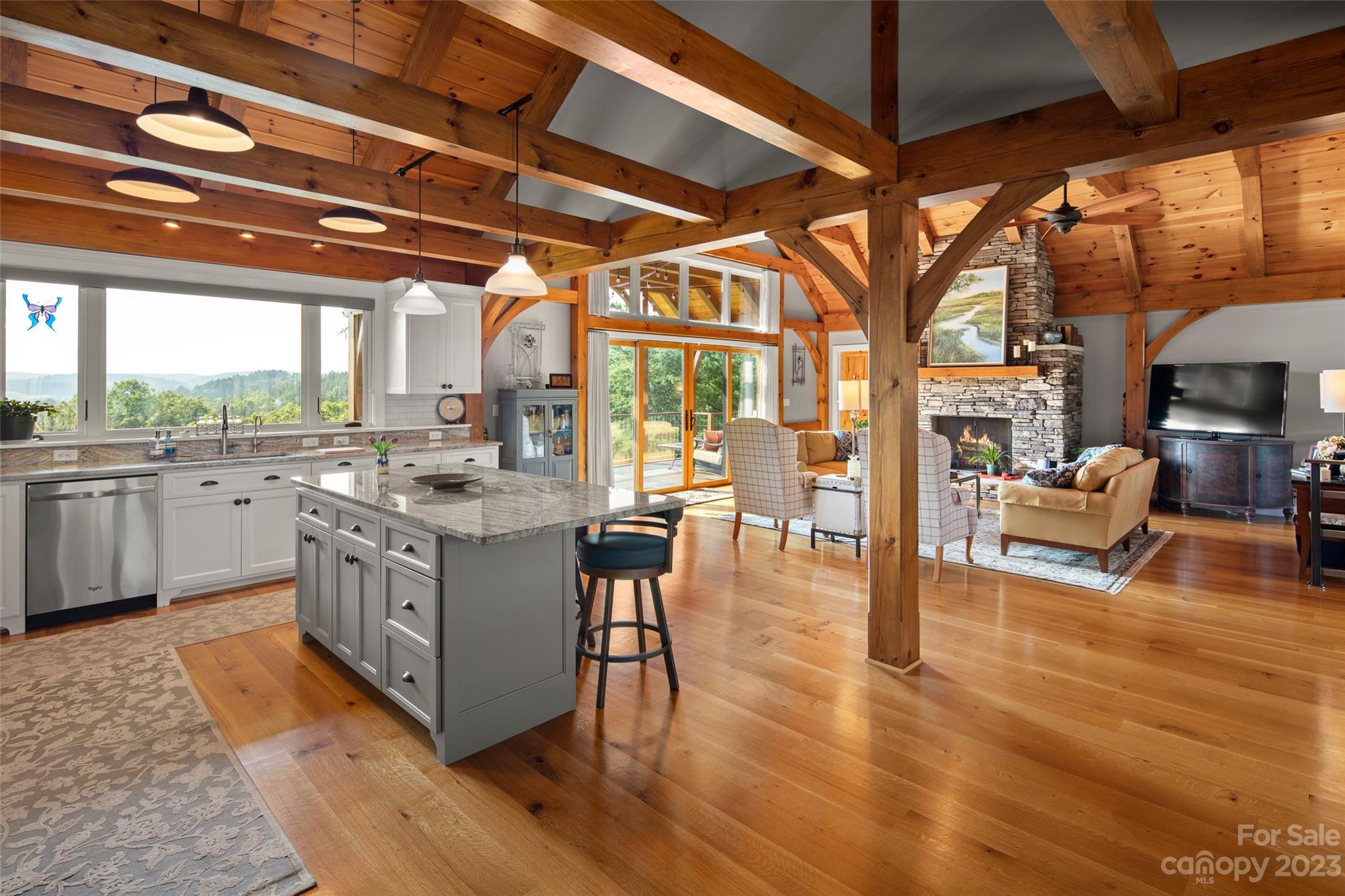 285 Red Tail Trail Mill Spring Mill Spring, NC 28756 - Photo 14 of 48 a kitchen with stainless steel appliances granite countertop a stove and wooden floors