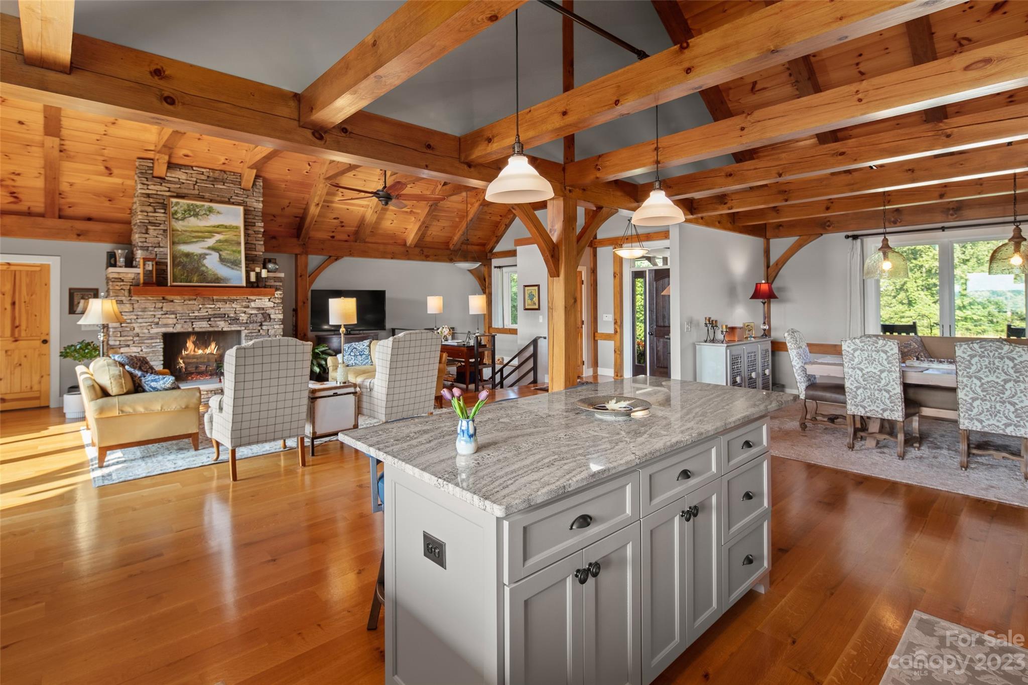 285 Red Tail Trail Mill Spring Mill Spring, NC 28756 - Photo 15 of 48 a kitchen with stainless steel appliances granite countertop a stove a sink and a wooden floors