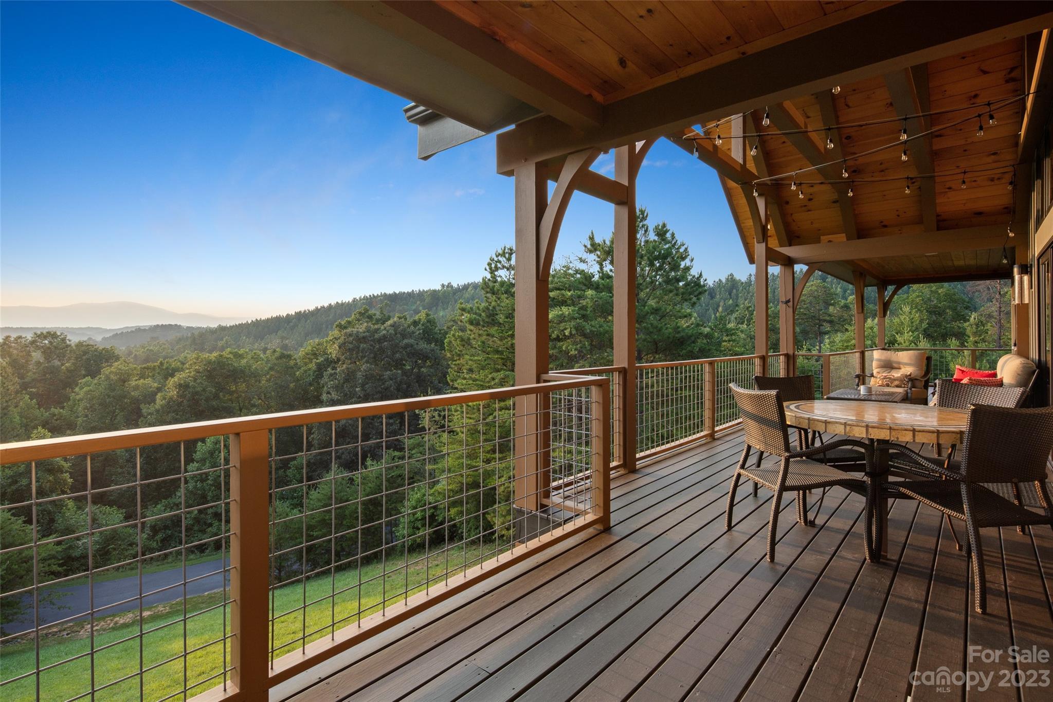 285 Red Tail Trail Mill Spring Mill Spring, NC 28756 - Photo 21 of 48 a view of a chairs and table in the balcony