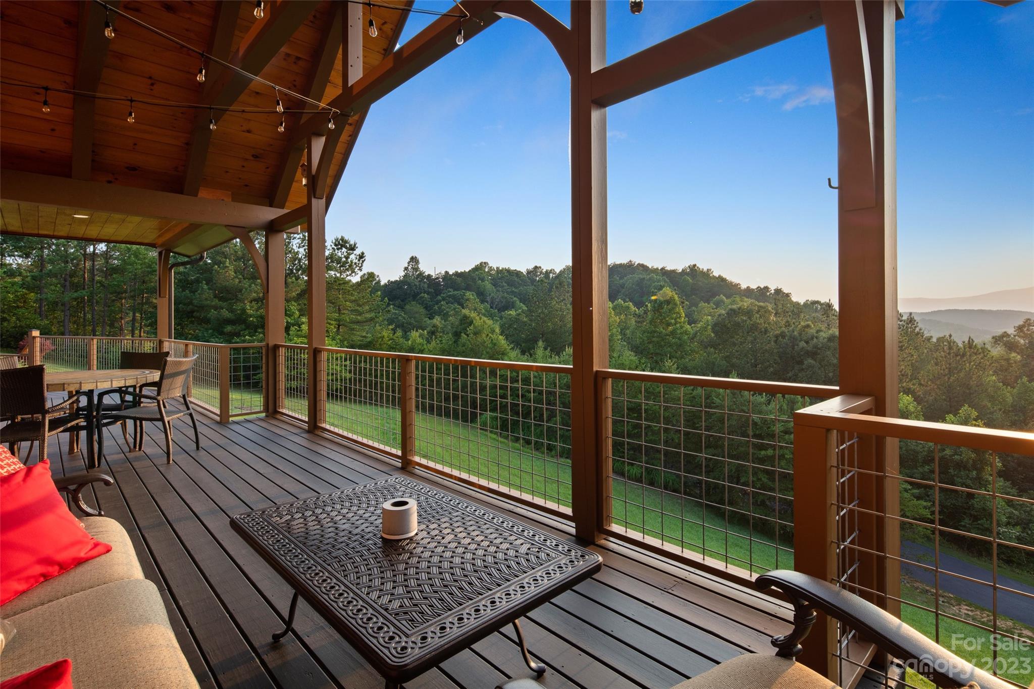 285 Red Tail Trail Mill Spring Mill Spring, NC 28756 - Photo 22 of 48 a view of a balcony with wooden floor next to a yard