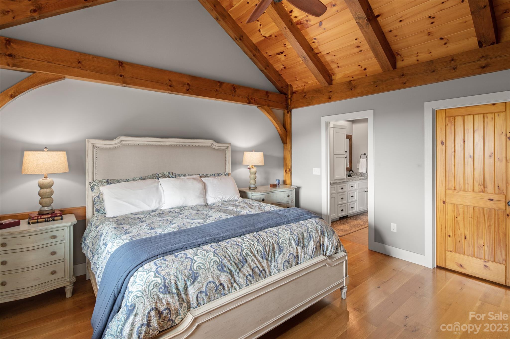 285 Red Tail Trail Mill Spring Mill Spring, NC 28756 - Photo 23 of 48 a bedroom with a bed and a lamp