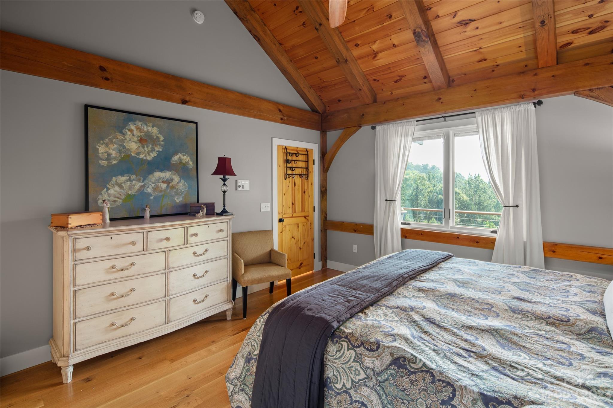285 Red Tail Trail Mill Spring Mill Spring, NC 28756 - Photo 24 of 48 a bedroom with a large bed and a window