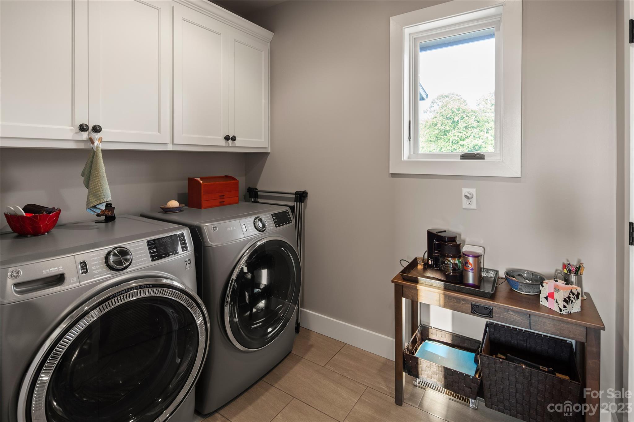 285 Red Tail Trail Mill Spring Mill Spring, NC 28756 - Photo 27 of 48 a utility room with dryer washer and a fridge