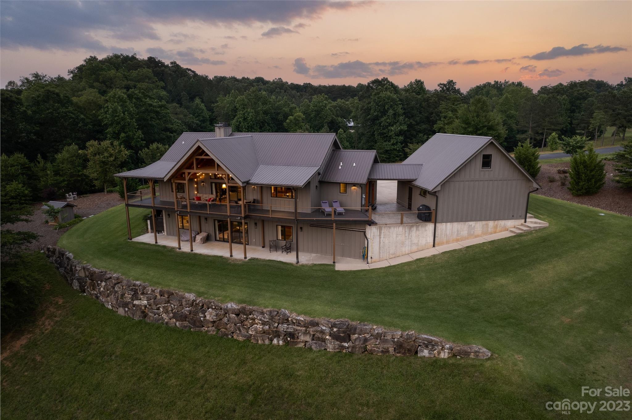 285 Red Tail Trail Mill Spring Mill Spring, NC 28756 - Photo 3 of 48 a front view of a house with a garden