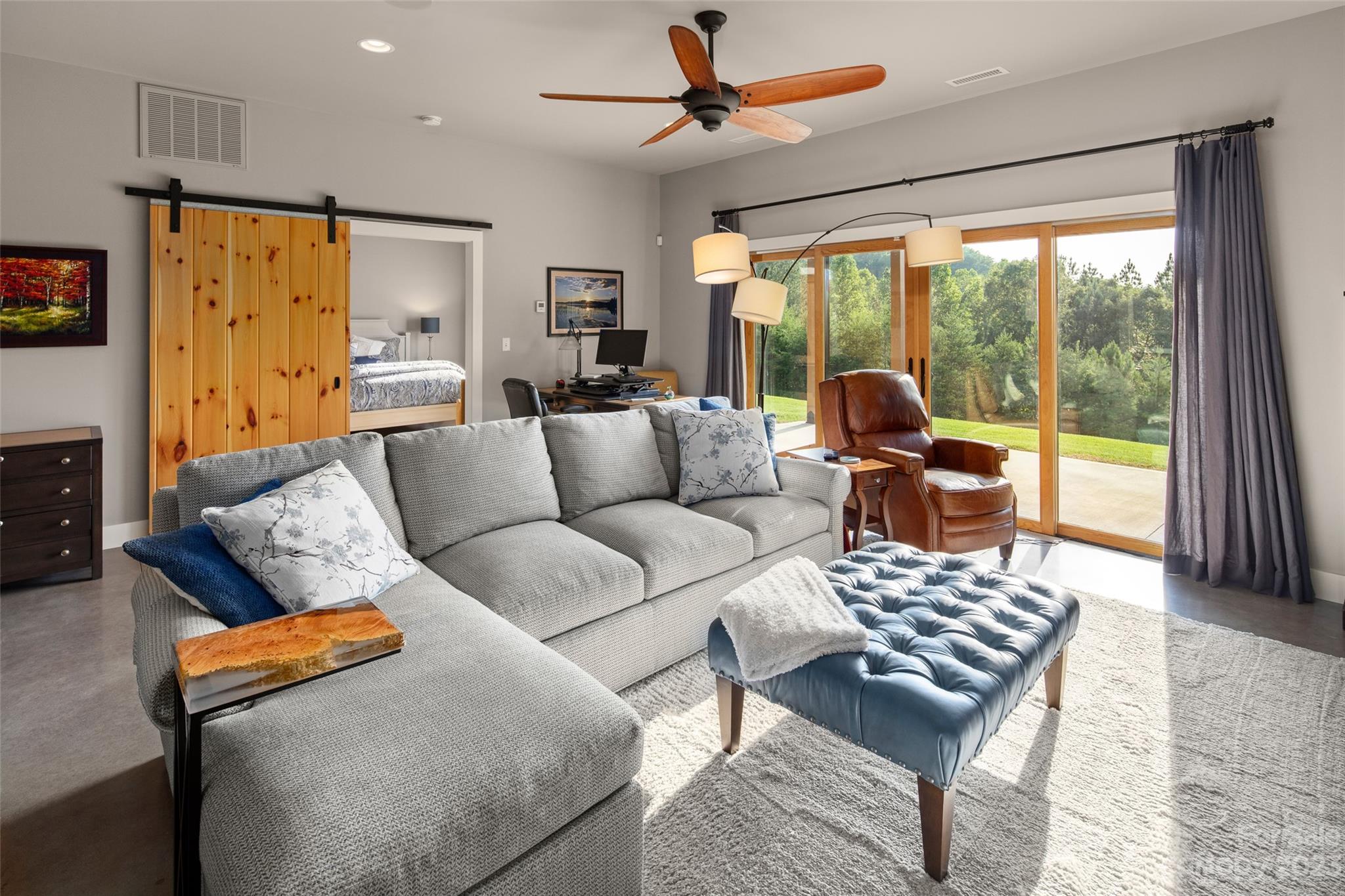 285 Red Tail Trail Mill Spring Mill Spring, NC 28756 - Photo 31 of 48 a living room with furniture and a flat screen tv