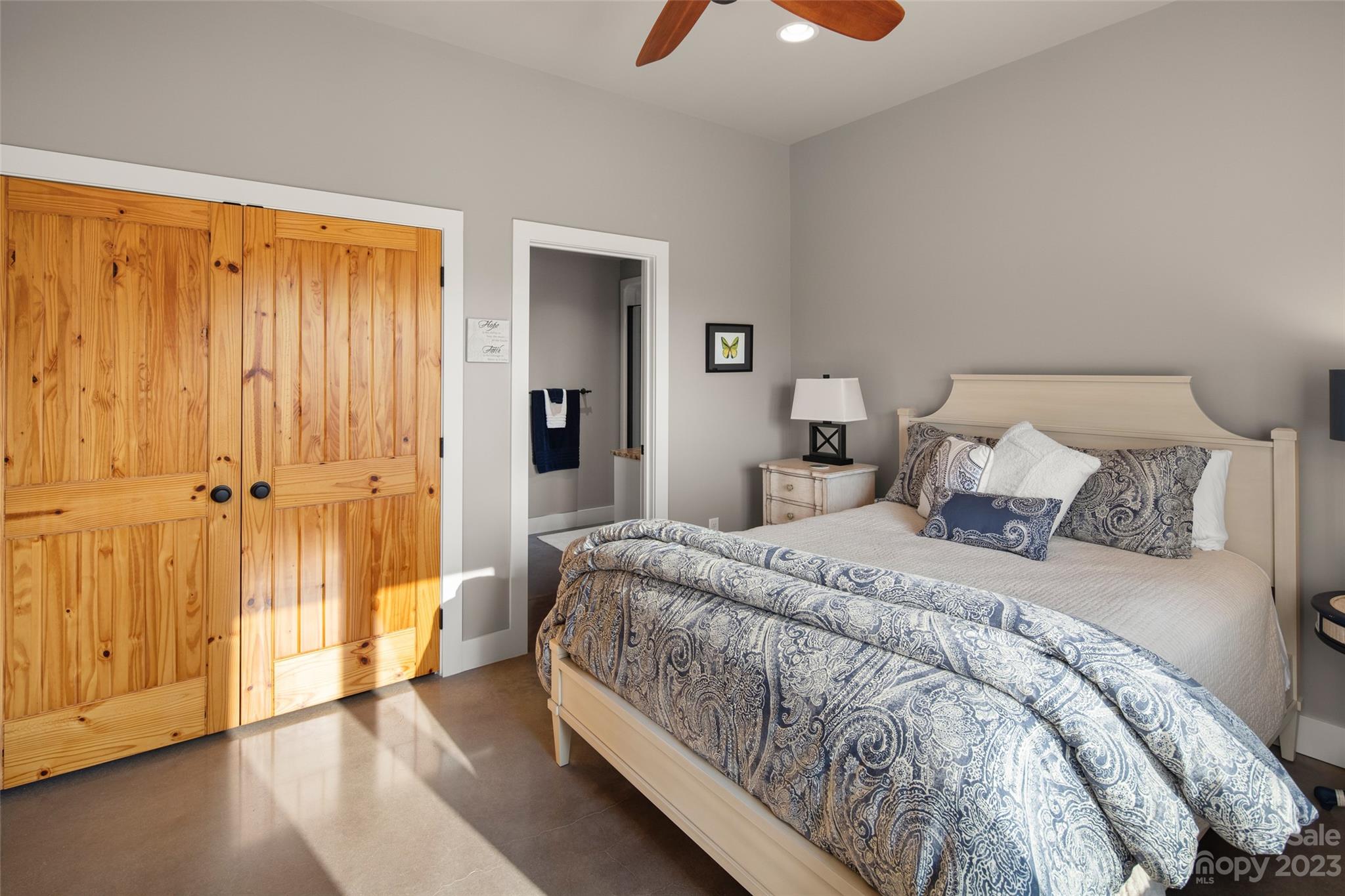 285 Red Tail Trail Mill Spring Mill Spring, NC 28756 - Photo 33 of 48 a spacious bedroom with a bed and wooden floor
