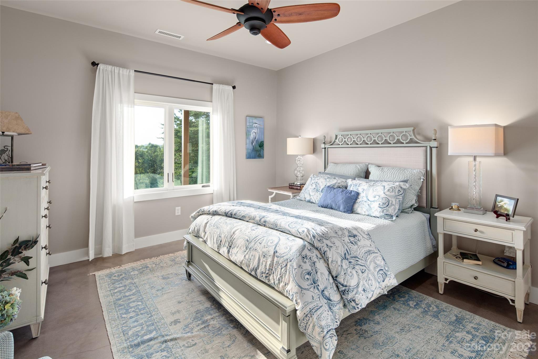 285 Red Tail Trail Mill Spring Mill Spring, NC 28756 - Photo 36 of 48 a bedroom with a bed and a ceiling fan