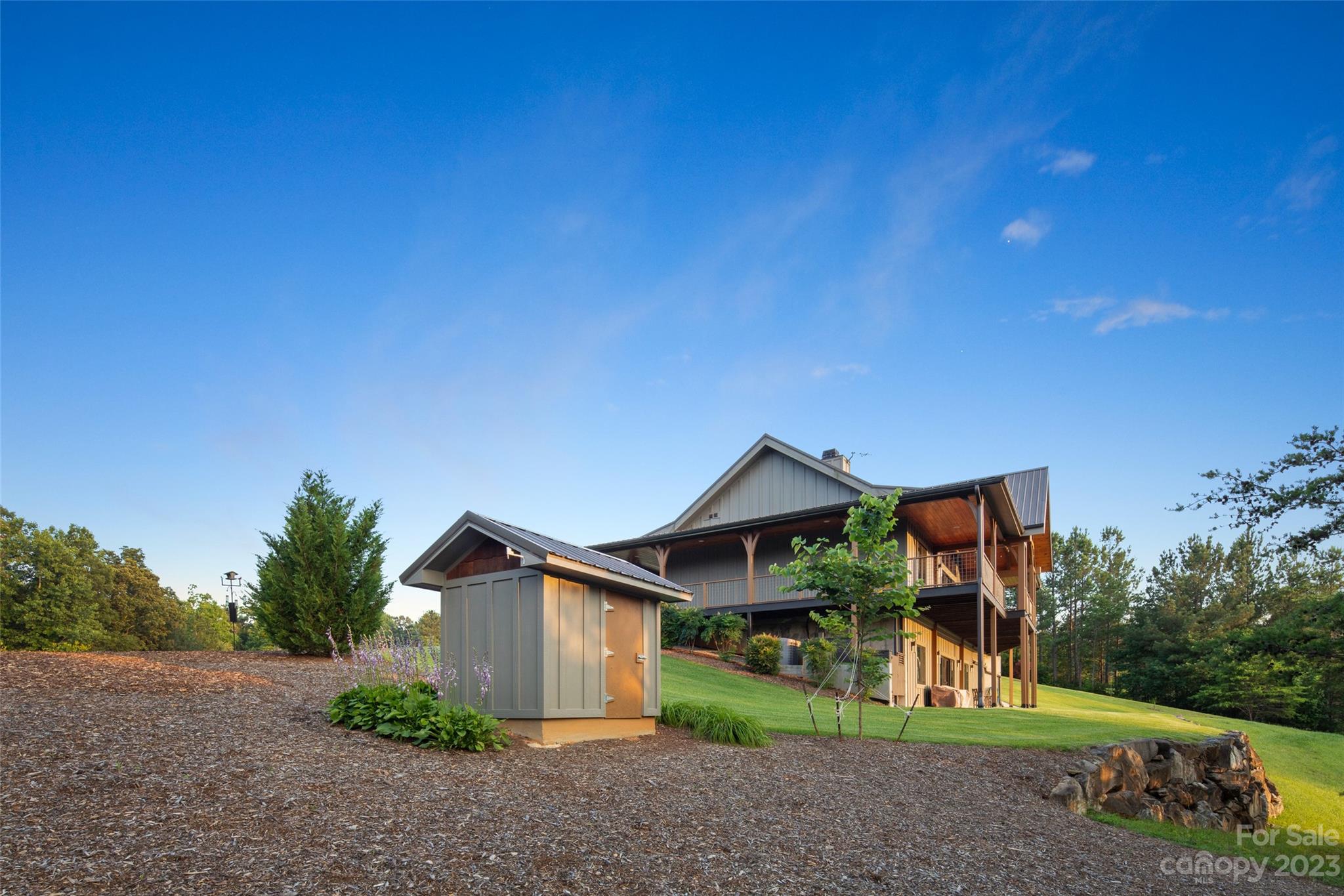 285 Red Tail Trail Mill Spring Mill Spring, NC 28756 - Photo 40 of 48 a front view of a house with a yard and garage