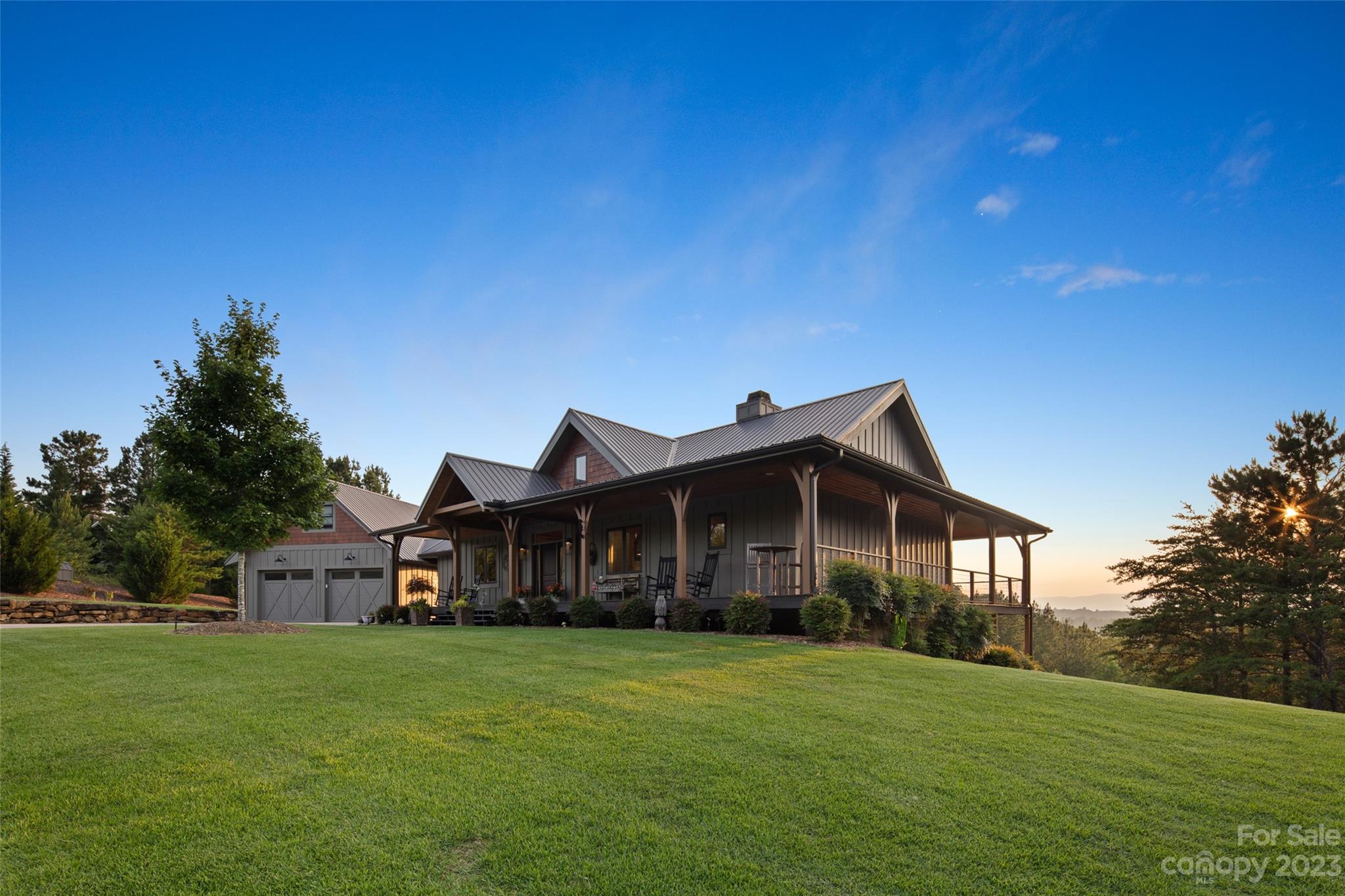 285 Red Tail Trail Mill Spring Mill Spring, NC 28756 - Photo 4 of 48 a front view of a house with a garden