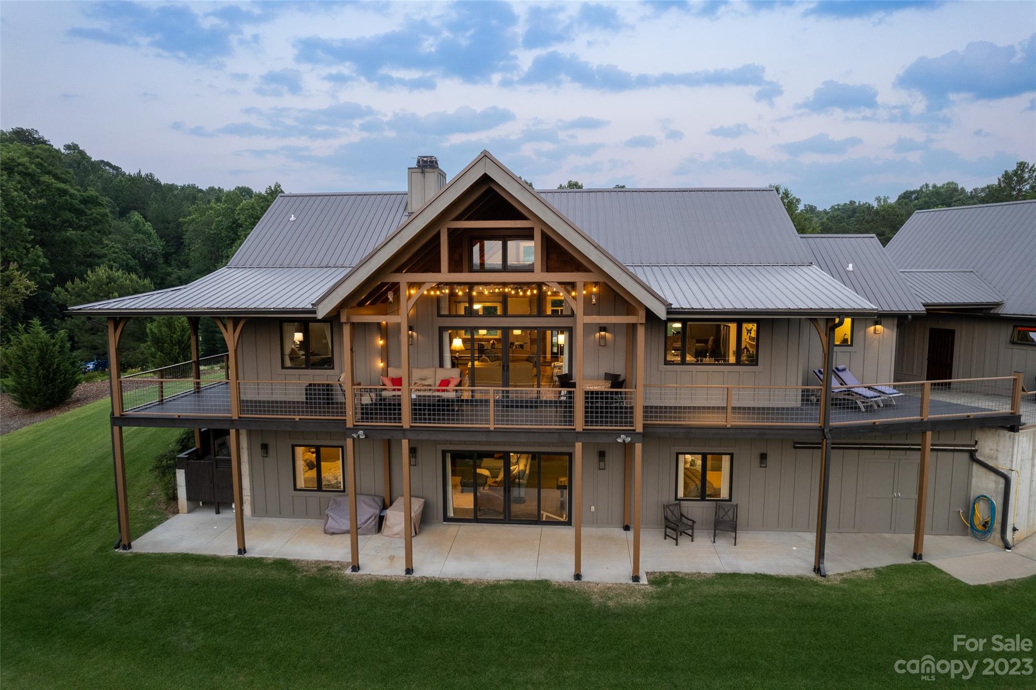 285 Red Tail Trail Mill Spring Mill Spring, NC 28756 - Photo 42 of 48 a front view of a house with a yard table and chairs