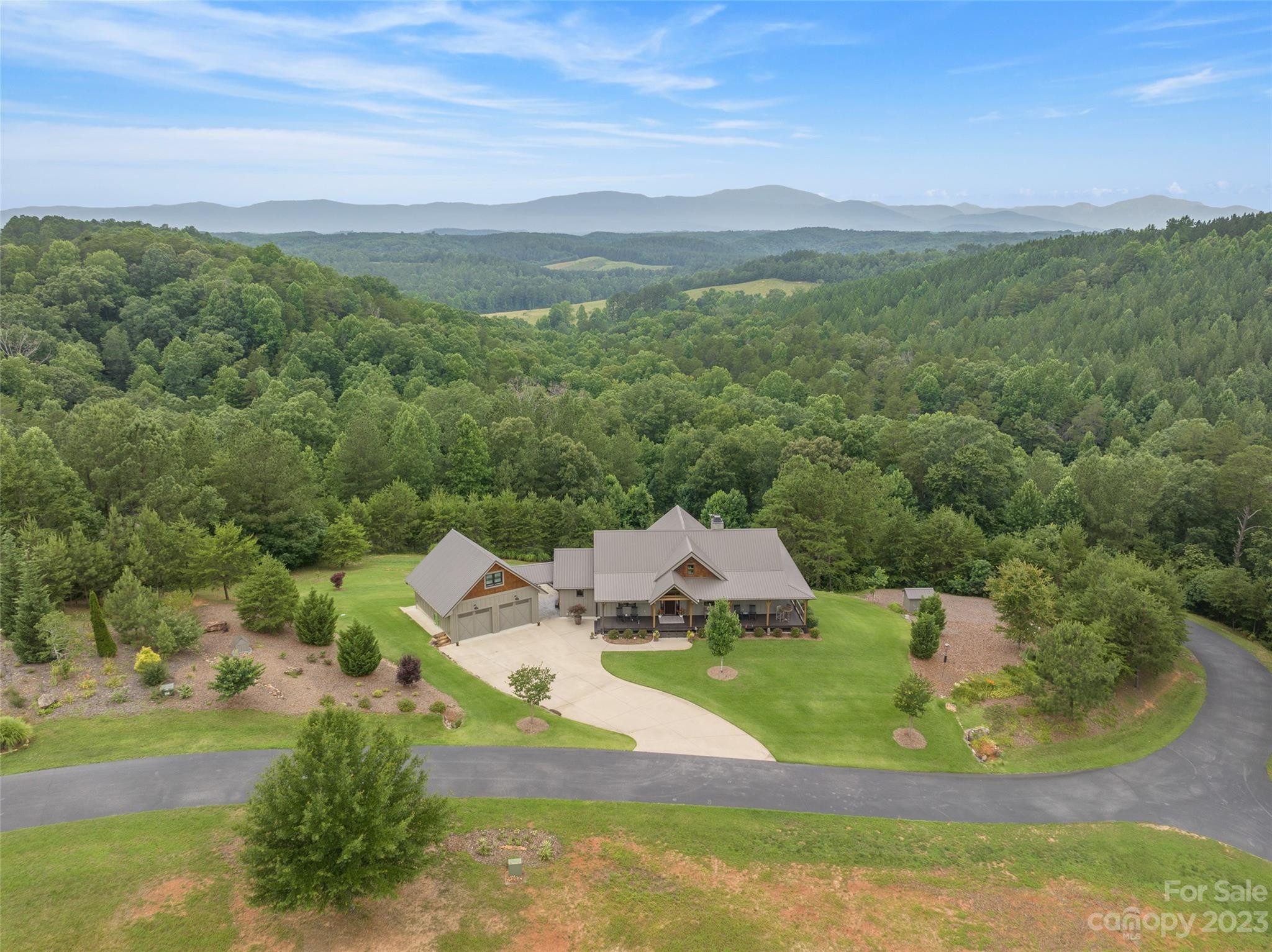 285 Red Tail Trail Mill Spring Mill Spring, NC 28756 - Photo 48 of 48 a view of a lake with a yard