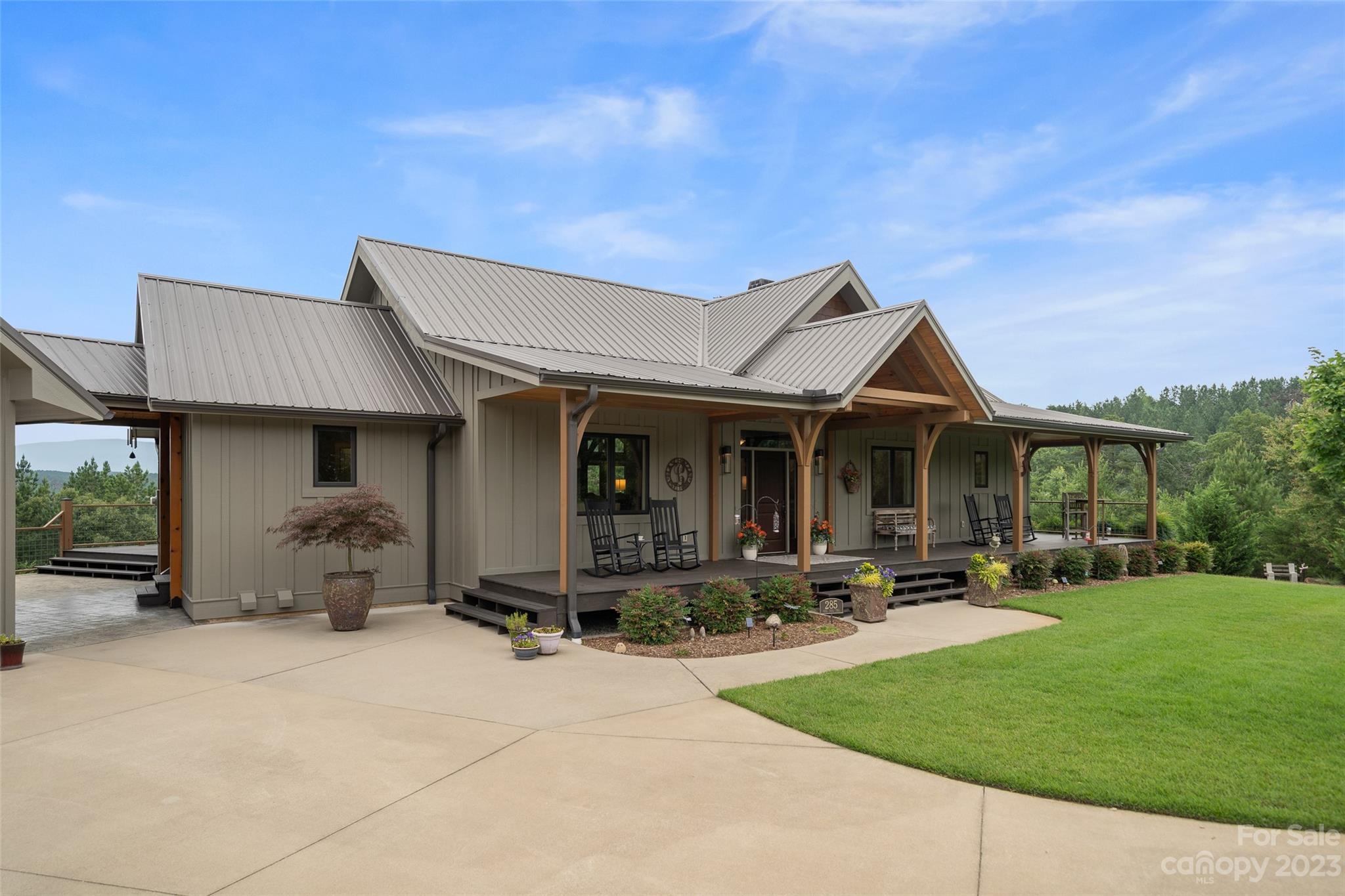 285 Red Tail Trail Mill Spring Mill Spring, NC 28756 - Photo 7 of 48 a front view of a house with patio